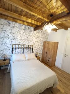 En eller flere senge i et værelse på Casa Rural Rio la Puente