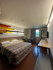 Postel nebo postele na pokoji v ubytování Hotel 10 Uniao da Vitoria