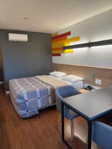 Postel nebo postele na pokoji v ubytování Hotel 10 Uniao da Vitoria