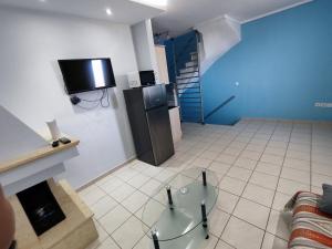 TV a/nebo společenská místnost v ubytování Seaside house
