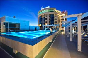 a swimming pool on the roof of a building at Sea View Tre Canne Apartment in Budva