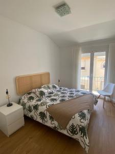 Ένα ή περισσότερα κρεβάτια σε δωμάτιο στο Junto à Praia