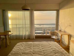 En eller flere senge i et værelse på Cocon zen, face mer, plein ciel