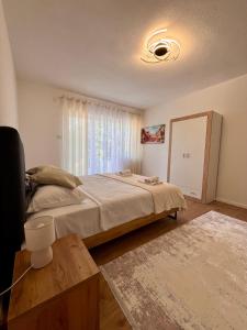 a bedroom with a large bed and a window at Villa Crystal in Bihać +65 photos