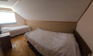 Ένα ή περισσότερα κρεβάτια σε δωμάτιο στο Casa cómoda y funcional