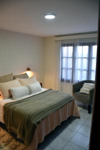 Ένα ή περισσότερα κρεβάτια σε δωμάτιο στο Hotel Casablanca Melo, Córdoba, Argentina