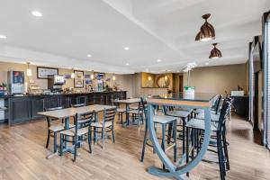 a dining room and kitchen with tables and chairs at Best Western Inn of Del Rio in Del Rio