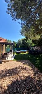 a park with a picnic table and a gazebo at villa Paty in Bonifacio