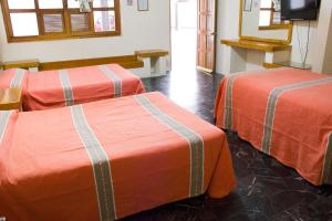 Postel nebo postele na pokoji v ubytování Hotel Avenida Ixmiquilpan