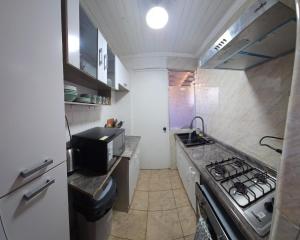 Η κουζίνα ή μικρή κουζίνα στο Casa cómoda y funcional +9 φωτογραφίες