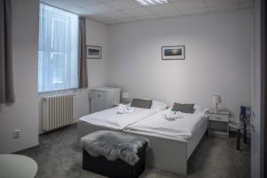 Postel nebo postele na pokoji v ubytování CLASSIC apartmány Třinec