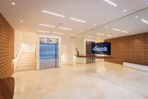 Televízia a/alebo spoločenská miestnosť v ubytovaní Vienna Grand Apartments DANUBE