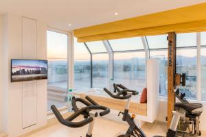 Televízia a/alebo spoločenská miestnosť v ubytovaní Vienna Grand Apartments DANUBE