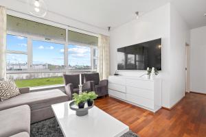 TV a/nebo společenská místnost v ubytování River Apartments