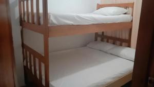 Postel nebo postele na pokoji v ubytování HOSTAL LA BOQUILLA