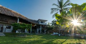 a view of the courtyard of a resort at Casa Manzanillo - Ocean Room - Ocean View Room at Exceptional Beach Front Location in Troncones