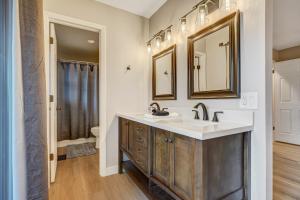 a bathroom with a sink and a toilet at El Dorado- Cozy Retreat-Hot Tub-Upper Level in Pikeview +18 photos