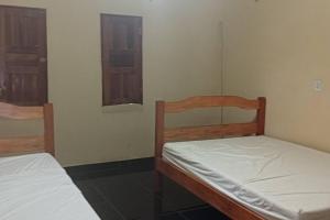 Postel nebo postele na pokoji v ubytování Chácara com chalé