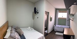 Hotel Chão Mineiro客房内的一张或多张床位
