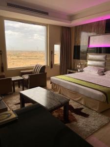 Postel nebo postele na pokoji v ubytování Al- Reef Hotel