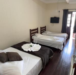 Hotel Chão Mineiro客房内的一张或多张床位