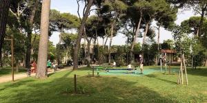a group of people playing in a park at leuca bis house in Lecce +5 photos