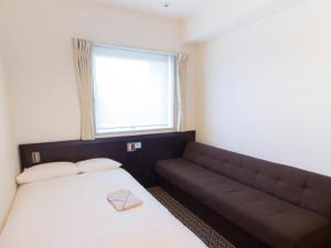 Postel nebo postele na pokoji v ubytování Hearton Hotel Higashi-Shinagawa
