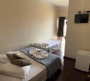 Hotel Chão Mineiro客房内的一张或多张床位