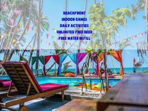 a pool with a chair and a table and a sign at iHome Backpacker Resort in Mui Ne