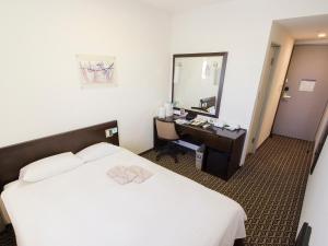 Postel nebo postele na pokoji v ubytování Hearton Hotel Higashi-Shinagawa