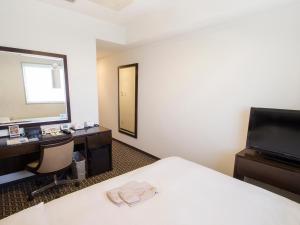 Postel nebo postele na pokoji v ubytování Hearton Hotel Higashi-Shinagawa