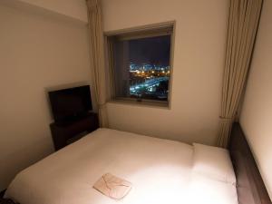 Postel nebo postele na pokoji v ubytování Hearton Hotel Higashi-Shinagawa