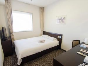 Postel nebo postele na pokoji v ubytování Hearton Hotel Higashi-Shinagawa