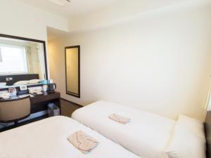 Postel nebo postele na pokoji v ubytování Hearton Hotel Higashi-Shinagawa
