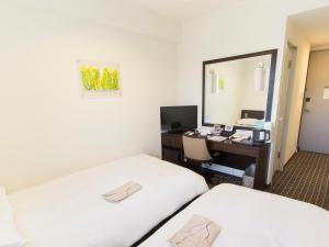Postel nebo postele na pokoji v ubytování Hearton Hotel Higashi-Shinagawa