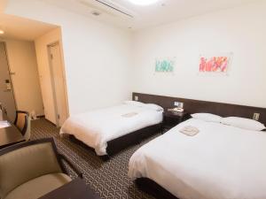 Postel nebo postele na pokoji v ubytování Hearton Hotel Higashi-Shinagawa