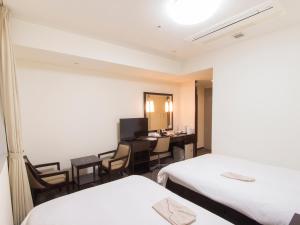 Postel nebo postele na pokoji v ubytování Hearton Hotel Higashi-Shinagawa