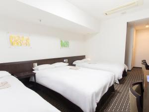 Postel nebo postele na pokoji v ubytování Hearton Hotel Higashi-Shinagawa