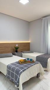 Katil atau katil-katil dalam bilik di Apto das Lavandas - 2 quartos - Apto todo climatizado - à 150m do Parque Termal! +21 gambar