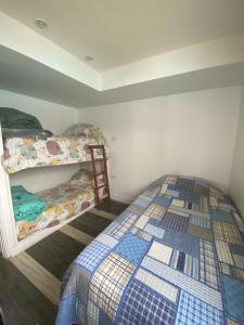 a bedroom with two bunk beds in a room at San Alfonso del mar ,gran vista in Algarrobo +21 photos