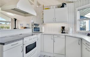 Kuchyň nebo kuchyňský kout v ubytování Holiday Home Lensg