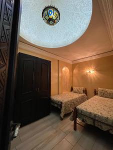 Ένα ή περισσότερα κρεβάτια σε δωμάτιο στο Appartement vue sur mer