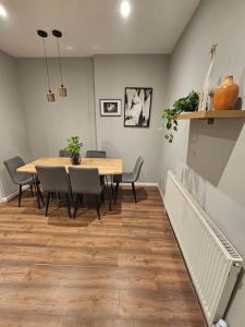 a dining room with a table and chairs at Hillsome Hosting Wigan in Pemberton +24 photos