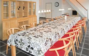 a table with a black and white patterned table cloth at Seven-Bedroom Holiday Home In Bredebro in Bredebro +16 photos