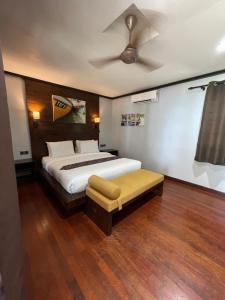 a bedroom with a bed and a ceiling fan at Perhentian Island Resort in Perhentian Islands