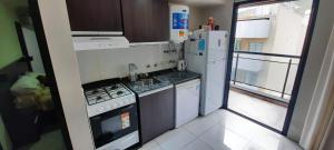 Kuchyň nebo kuchyňský kout v ubytování Miralejos 7 Music