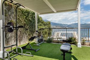 a gym with a view of the water at All'oro in Njivice