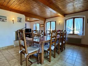a dining room with a wooden table and chairs at Maison 4 pièces à Oléron avec WIFI et jardin proche plage - FR-1-246A-322 in Saint-Pierre-dʼOléron +13 photos