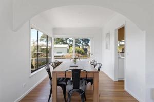a dining room with a table and chairs at Sommerhuset by Ready Set Stay in Cowes