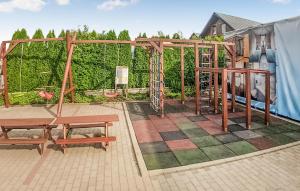 a playground with a picnic table and a bench at Lovely Home In Rewal With Wi-Fi in Rewal +9 photos